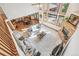 Bright and airy living room featuring large windows, fireplace, and open layout to the dining area at 942 Xenon Ct, Golden, CO 80401