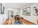 Bright home office featuring hardwood floors, a large window, and a stylish desk setup at 942 Xenon Ct, Golden, CO 80401