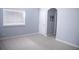 Light and airy bedroom featuring neutral carpet, trim, and an abundance of natural light at 6588 S Sheridan Loop, Littleton, CO 80123