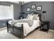 Stylish bedroom featuring a dark color scheme, modern lighting, and decorative accents at 6588 S Sheridan Loop, Littleton, CO 80123