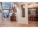 Inviting entryway with wood floors, iron-rail staircase, and views into the living and dining areas at 6588 S Sheridan Loop, Littleton, CO 80123