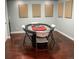 The game room boasts a poker table and stylish flooring at 6588 S Sheridan Loop, Littleton, CO 80123