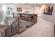 Upstairs hallway with wrought iron banister and view of the main floor at 6588 S Sheridan Loop, Littleton, CO 80123