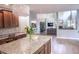 Gourmet kitchen with hardwood floors, granite counters, and open concept design at 6588 S Sheridan Loop, Littleton, CO 80123