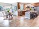 Bright kitchen and dining area with stainless appliances, wood cabinets, and island at 6588 S Sheridan Loop, Littleton, CO 80123