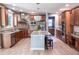 Spacious kitchen with granite countertops, stainless steel appliances, and a central island at 6588 S Sheridan Loop, Littleton, CO 80123