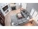 Aerial view of living room with fireplace and large, comfortable sectional sofa at 6588 S Sheridan Loop, Littleton, CO 80123