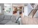 Spacious living room with hardwood floors and view to the eat in kitchen at 6588 S Sheridan Loop, Littleton, CO 80123