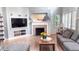 Living room features a fireplace, built-in shelving and entertainment system at 6588 S Sheridan Loop, Littleton, CO 80123
