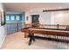 Spacious loft featuring a shuffleboard game table, elegant lighting, and railing with black iron pickets and wood at 6588 S Sheridan Loop, Littleton, CO 80123