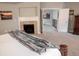 Spacious main bedroom featuring a fireplace and an open doorway to a second-story hallway at 6588 S Sheridan Loop, Littleton, CO 80123