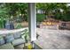 Inviting outdoor patio with stone pavers, a cozy seating area, and a warm fire pit at 6588 S Sheridan Loop, Littleton, CO 80123