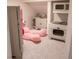 Playroom with play kitchen, a toy refrigerator, and a large pink plush toy at 6588 S Sheridan Loop, Littleton, CO 80123