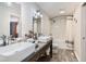 Bathroom featuring a double vanity, shower/tub combo, and modern fixtures at 7074 Yates St, Westminster, CO 80030