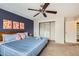 Bedroom featuring a large bed, statement wall art, and built-in closet shelving at 7074 Yates St, Westminster, CO 80030