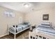 Bedroom featuring two twin beds, carpet, and neutral walls at 7074 Yates St, Westminster, CO 80030