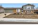 Charming split-level home with brick and siding exterior, attached garage, and a well-maintained front yard at 7074 Yates St, Westminster, CO 80030