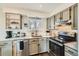 Updated kitchen featuring stainless steel appliances, granite countertops, subway tile backsplash, and ample cabinet space at 7074 Yates St, Westminster, CO 80030