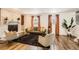 Inviting living room features a brick fireplace, modern furnishings, and lots of natural light at 7074 Yates St, Westminster, CO 80030