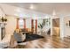 Bright living room features a fireplace, plush seating, and stairs leading to the upper level at 7074 Yates St, Westminster, CO 80030