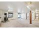 Finished basement featuring a vintage stove, bright lighting, and a sliding door leading to the exterior at 2043 E Nichols Dr, Centennial, CO 80122
