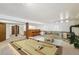 Finished basement with a pool table, bar, and a cozy seating area with a wood stove at 2043 E Nichols Dr, Centennial, CO 80122