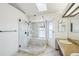 Updated bathroom features tile floor, glass shower, and neutral paint at 2043 E Nichols Dr, Centennial, CO 80122