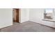 Neutral bedroom with a large window and an adjacent living space at 2043 E Nichols Dr, Centennial, CO 80122