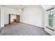 Large bedroom featuring a ceiling fan, newer carpet, and an adjacent study nook at 2043 E Nichols Dr, Centennial, CO 80122