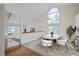 Dining room with large arched window, modern chandelier, and seating for six at 2043 E Nichols Dr, Centennial, CO 80122
