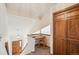Hallway features study nook, wood trim, and a view of the entryway at 2043 E Nichols Dr, Centennial, CO 80122