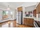 Well-lit kitchen area with wood cabinets and a cozy breakfast nook at 2043 E Nichols Dr, Centennial, CO 80122