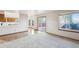 Spacious living room with lots of natural light, patio access, and hardwood floors at 2043 E Nichols Dr, Centennial, CO 80122