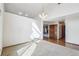 Open living room with hardwood floors, fireplace view, and ample natural light at 2043 E Nichols Dr, Centennial, CO 80122