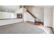 Spacious living room with staircase, hardwood floors, and carpet at 2043 E Nichols Dr, Centennial, CO 80122