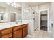 Clean bathroom with a walk-in shower and modern vanity at 9769 W Stanford Ave, Denver, CO 80123