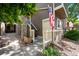 Charming entryway showcasing stone accents and a welcoming path, complemented by an American flag at 19663 E Mann Creek Dr # D, Parker, CO 80134