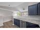 Bright kitchen features granite counters, stainless steel appliances, and white backsplash at 19663 E Mann Creek Dr # D, Parker, CO 80134