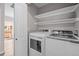Well-lit laundry room with newer washer and dryer at 19663 E Mann Creek Dr # D, Parker, CO 80134