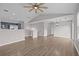 Expansive living space showcasing vaulted ceilings and a seamless transition to the modern kitchen at 19663 E Mann Creek Dr # D, Parker, CO 80134
