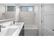 Modern bathroom with a double sink vanity, illuminated mirror, and contemporary fixtures at 1256 Yates St, Denver, CO 80204