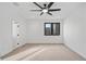 A bright bedroom featuring plush carpeting, modern ceiling fan, and one window at 1256 Yates St, Denver, CO 80204