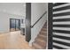 Inviting home entryway with a staircase and a view of the open-concept kitchen at 1256 Yates St, Denver, CO 80204