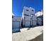 Back view showing the garages of the modern townhome units at 1256 Yates St, Denver, CO 80204