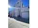 Back view showing the garages of the modern townhome units at 1256 Yates St, Denver, CO 80204