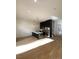 Modern kitchen featuring a quartz island, stainless steel appliances, and pendant lighting at 1256 Yates St, Denver, CO 80204