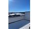 Rooftop deck with view of snow covered field and exterior construction at 1256 Yates St, Denver, CO 80204