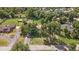 Scenic aerial view of the property with spacious lawns, mature trees, and charming neighborhood at 7750 W 5Th Ave, Lakewood, CO 80226