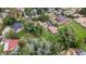 Gorgeous aerial view of the property with lush lawns, mature trees, and surrounding neighborhood at 7750 W 5Th Ave, Lakewood, CO 80226
