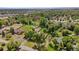Expansive aerial view of the property with lush greenery, mature trees, and neighborhood surroundings at 7750 W 5Th Ave, Lakewood, CO 80226